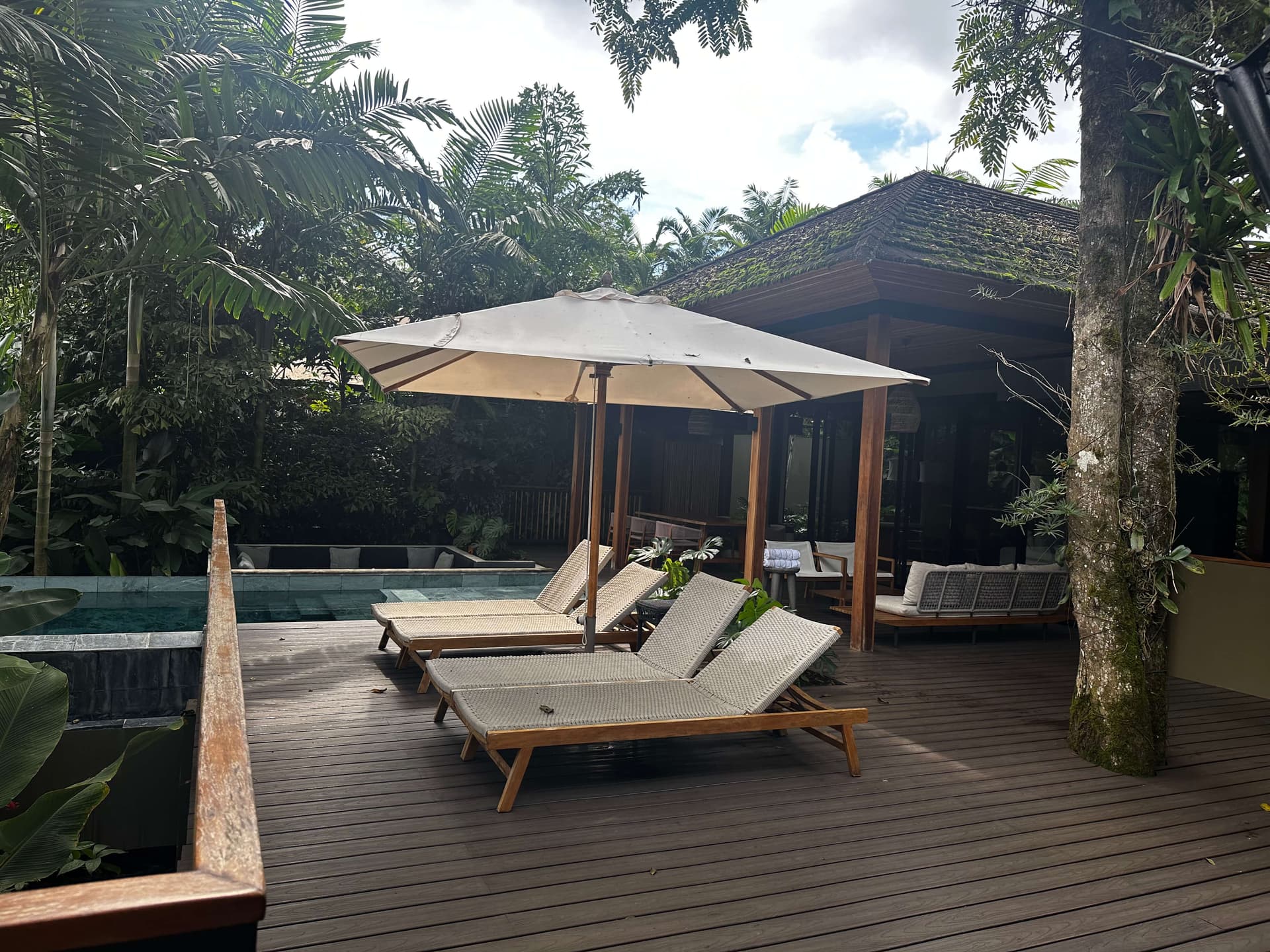 Private pool and wooden deck with lounge chairs at Casa Dana, Nayara Tented Camp, Costa Rica.